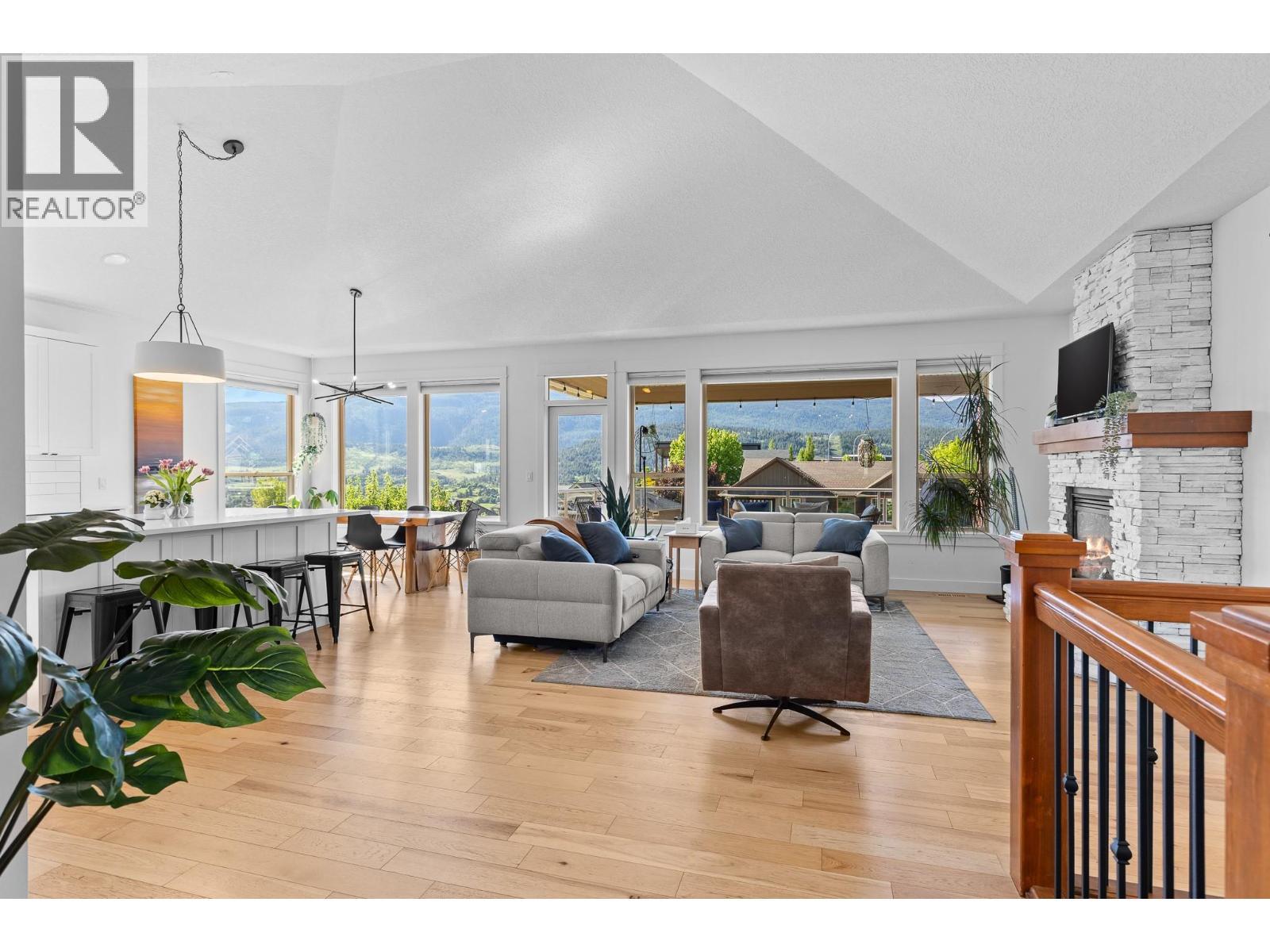 514 Mt. Tanner Place, Coldstream, BC - Indoor Photo Showing Living Room With Fireplace