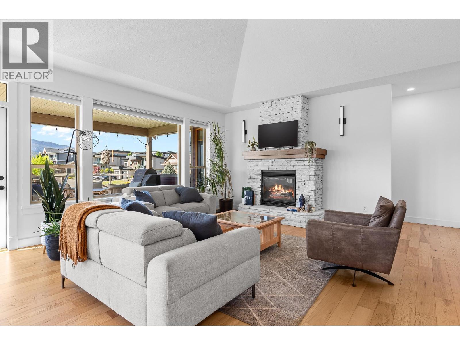 514 Mt. Tanner Place, Coldstream, BC - Indoor Photo Showing Living Room With Fireplace