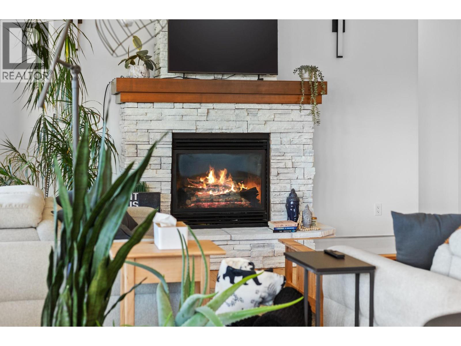 514 Mt. Tanner Place, Coldstream, BC - Indoor Photo Showing Living Room With Fireplace