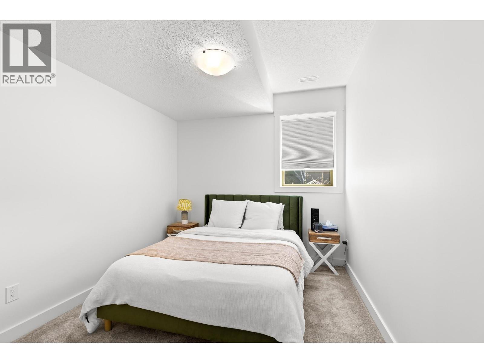 514 Mt. Tanner Place, Coldstream, BC - Indoor Photo Showing Bedroom