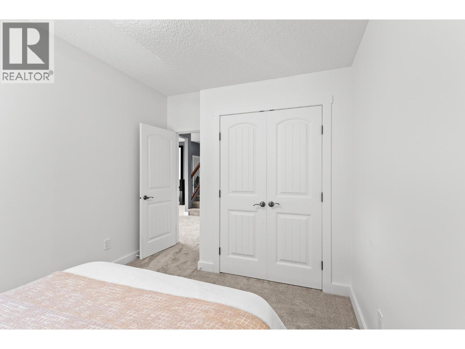 514 Mt. Tanner Place, Coldstream, BC - Indoor Photo Showing Bedroom