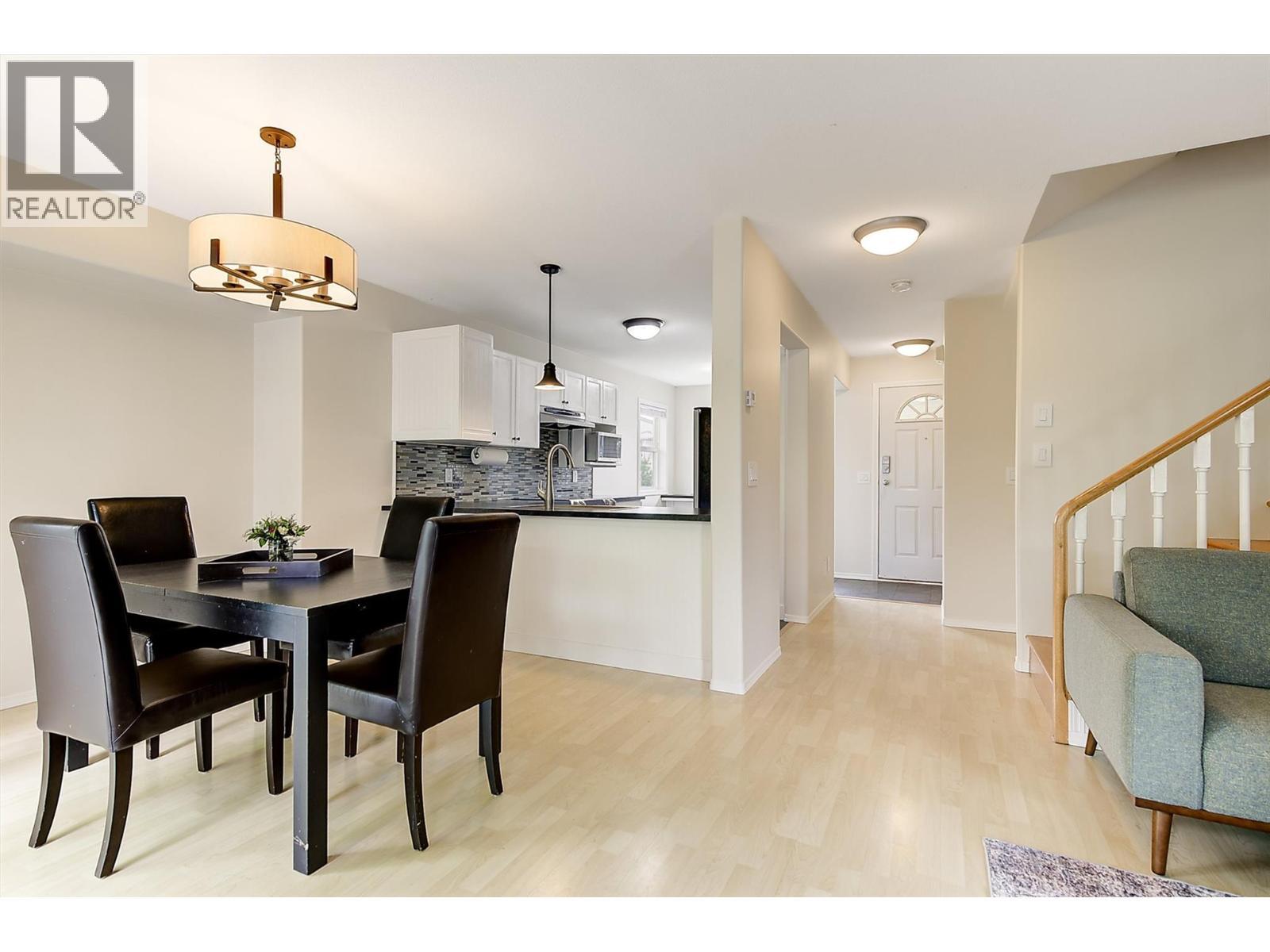 Dining to kitchen - 133 Wyndham Crescent Unit# 110, Kelowna, BC - Indoor Photo Showing Dining Room