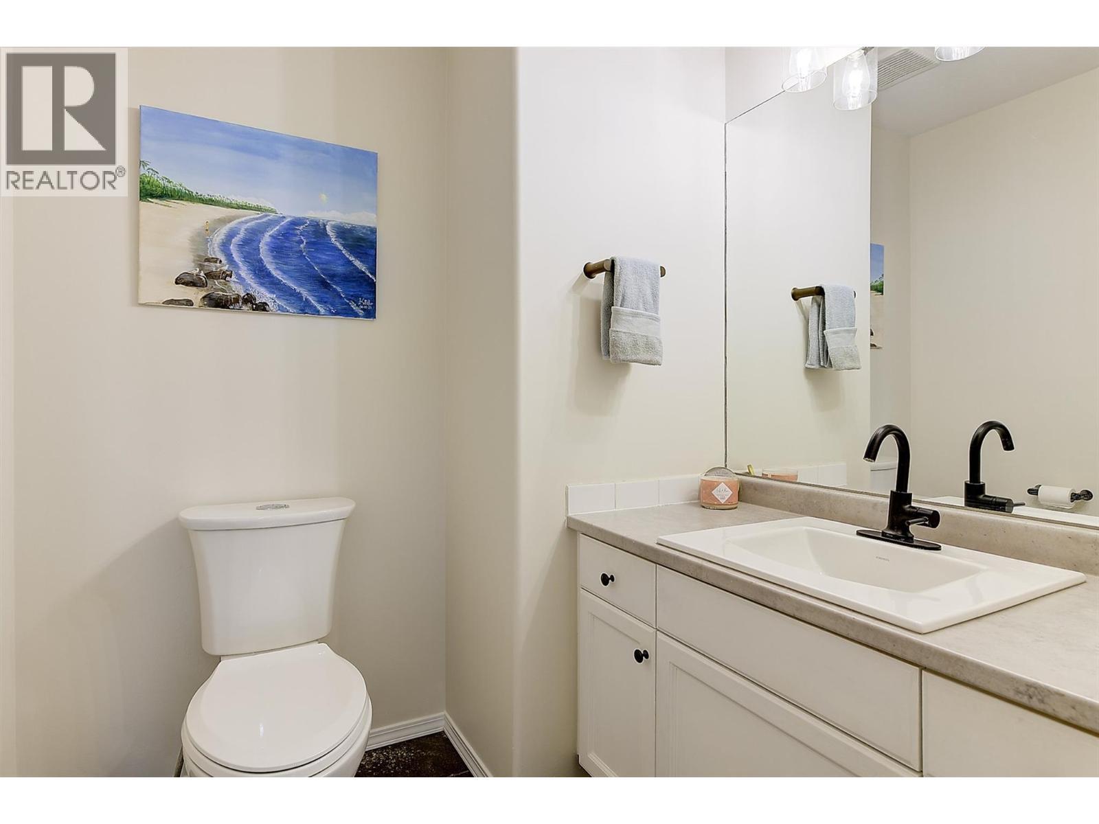 Powder room on the main level - 133 Wyndham Crescent Unit# 110, Kelowna, BC - Indoor Photo Showing Bathroom