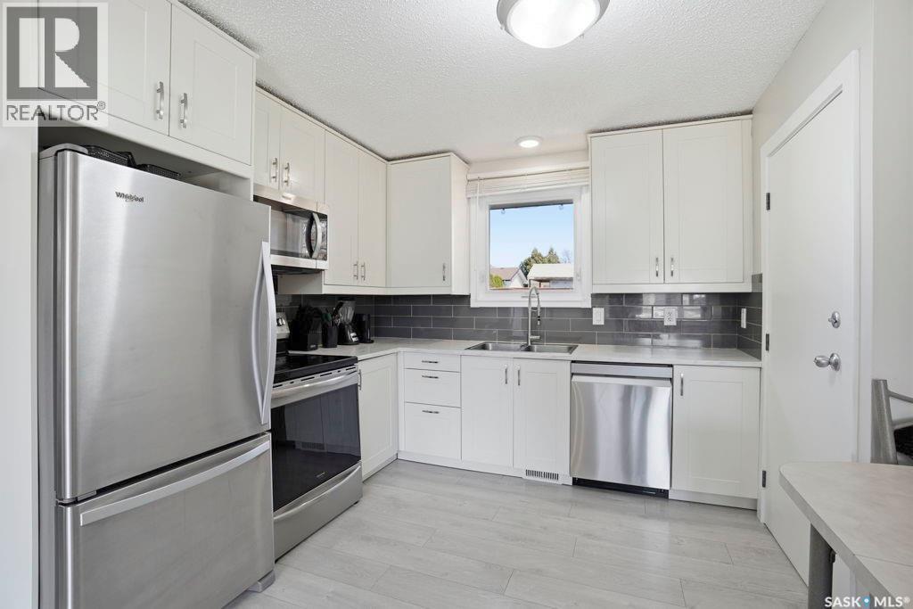 38 Cartier Crescent, Saskatoon, SK - Indoor Photo Showing Kitchen With Double Sink