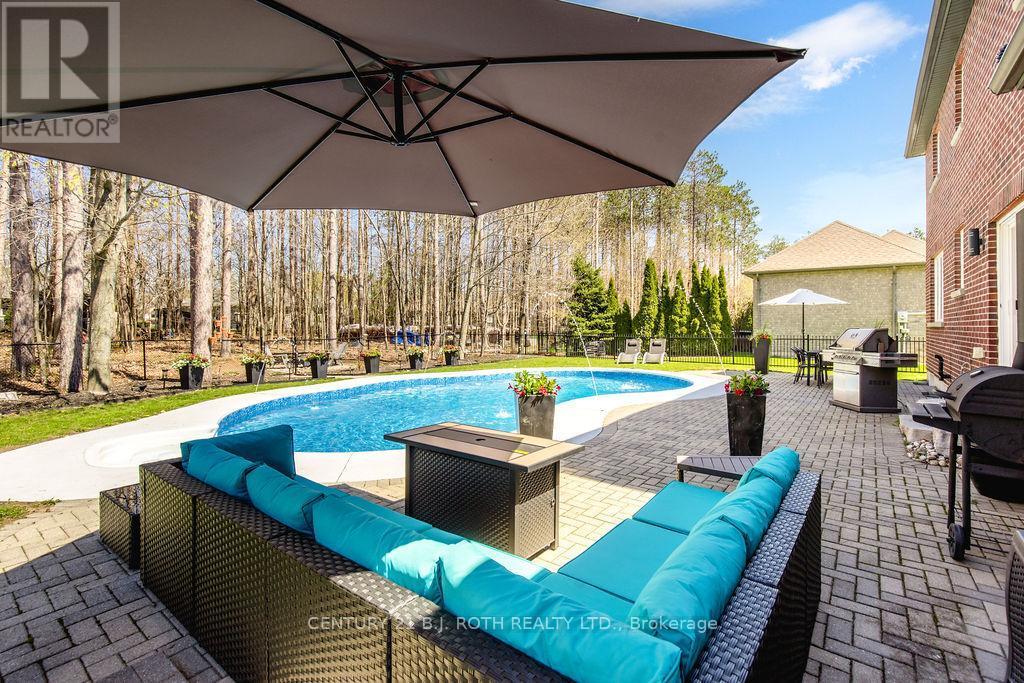 12 Lloyd Cook Drive E, Springwater, ON - Outdoor With In Ground Pool With Deck Patio Veranda
