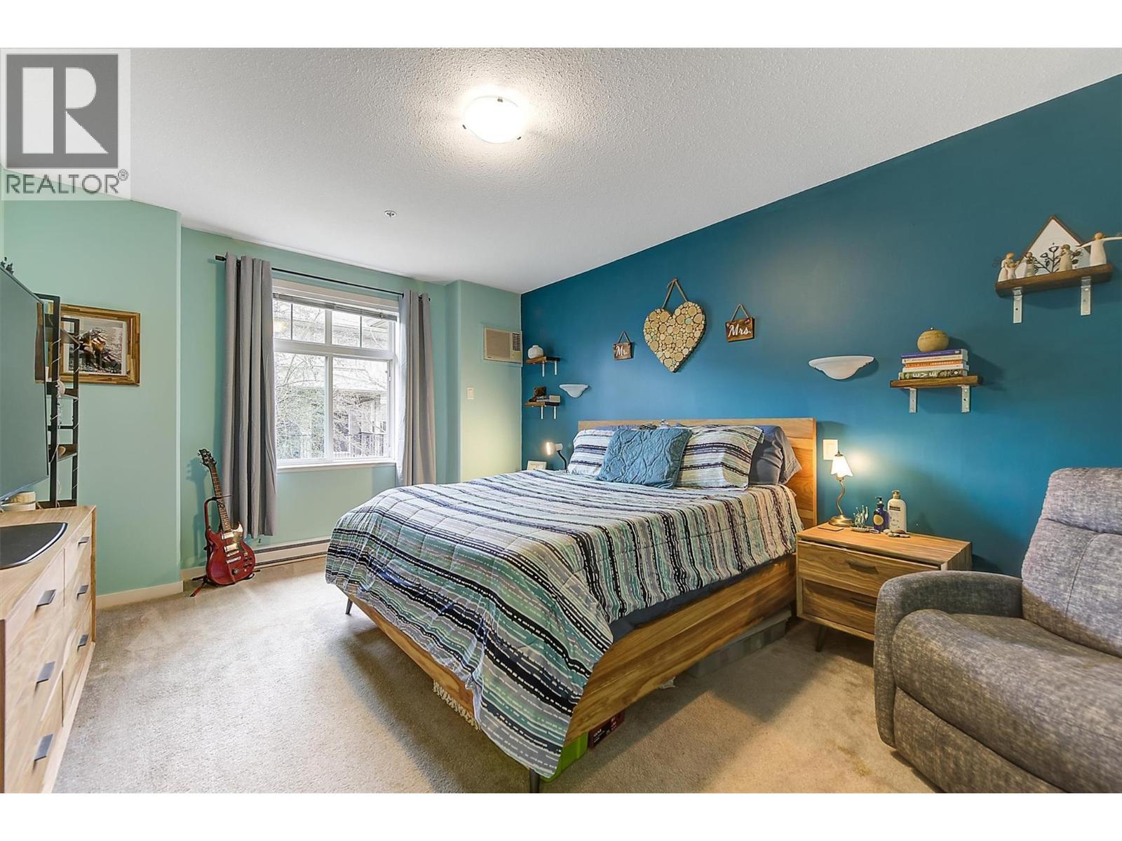 307 Whitman Road Unit# 206, Kelowna, BC - Indoor Photo Showing Bedroom