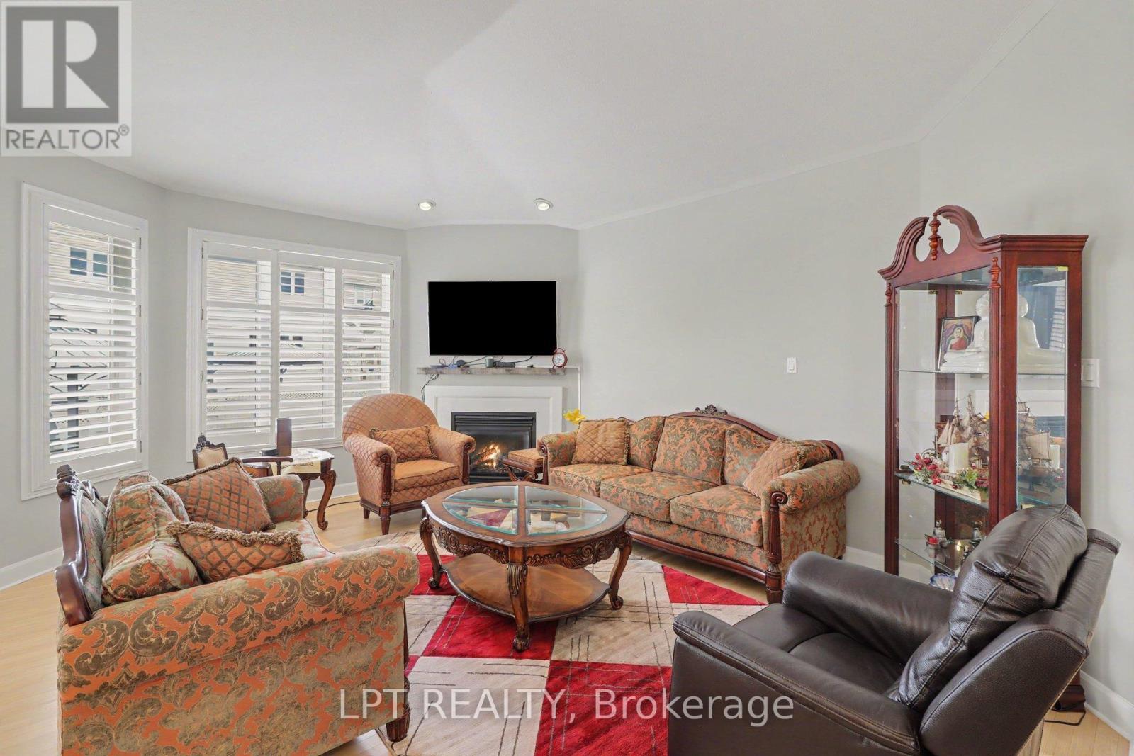 1942 Caprihani Way, Ottawa, ON - Indoor Photo Showing Living Room With Fireplace