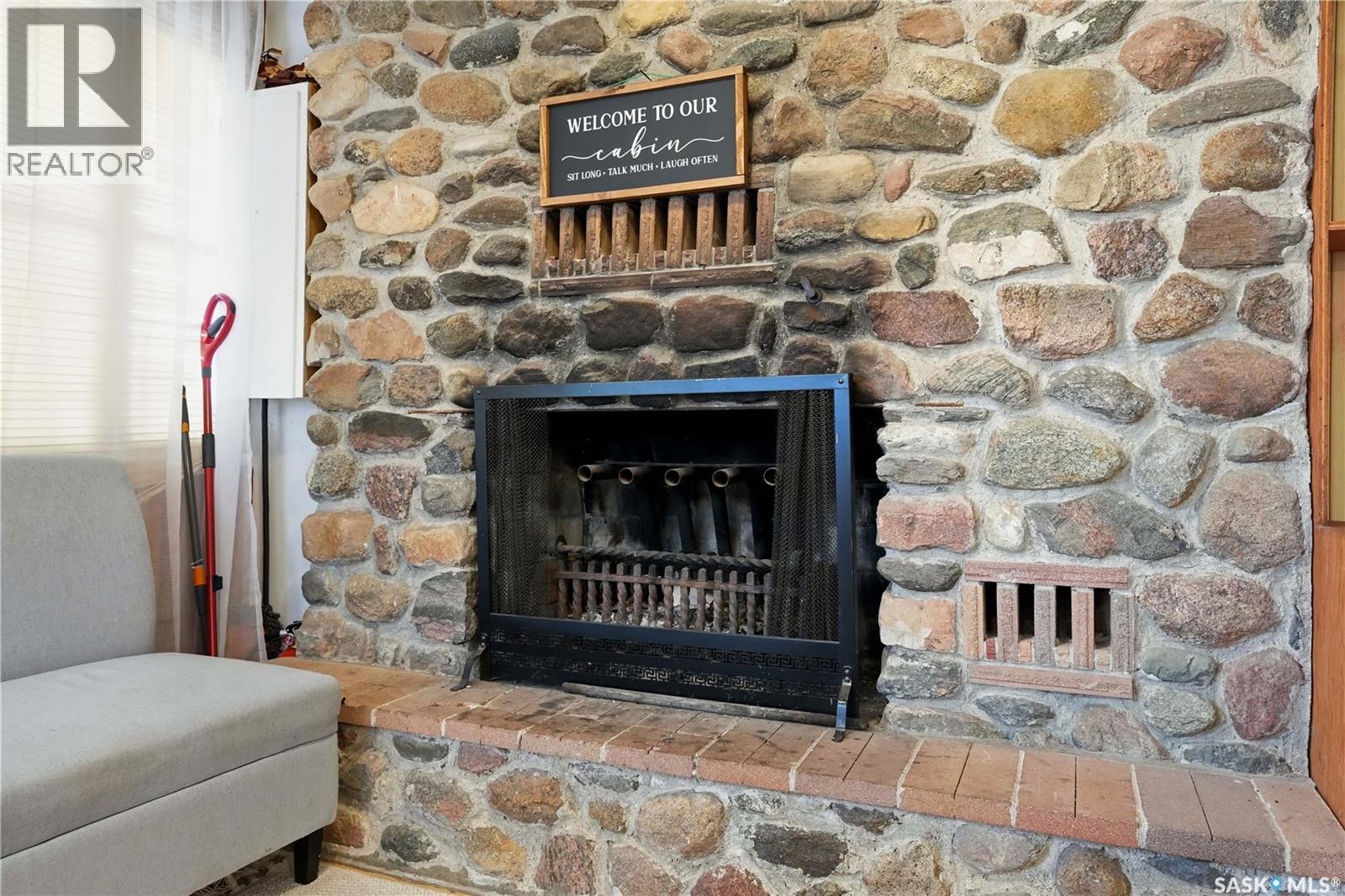 228A Green Avenue, Regina Beach, SK - Indoor Photo Showing Living Room With Fireplace