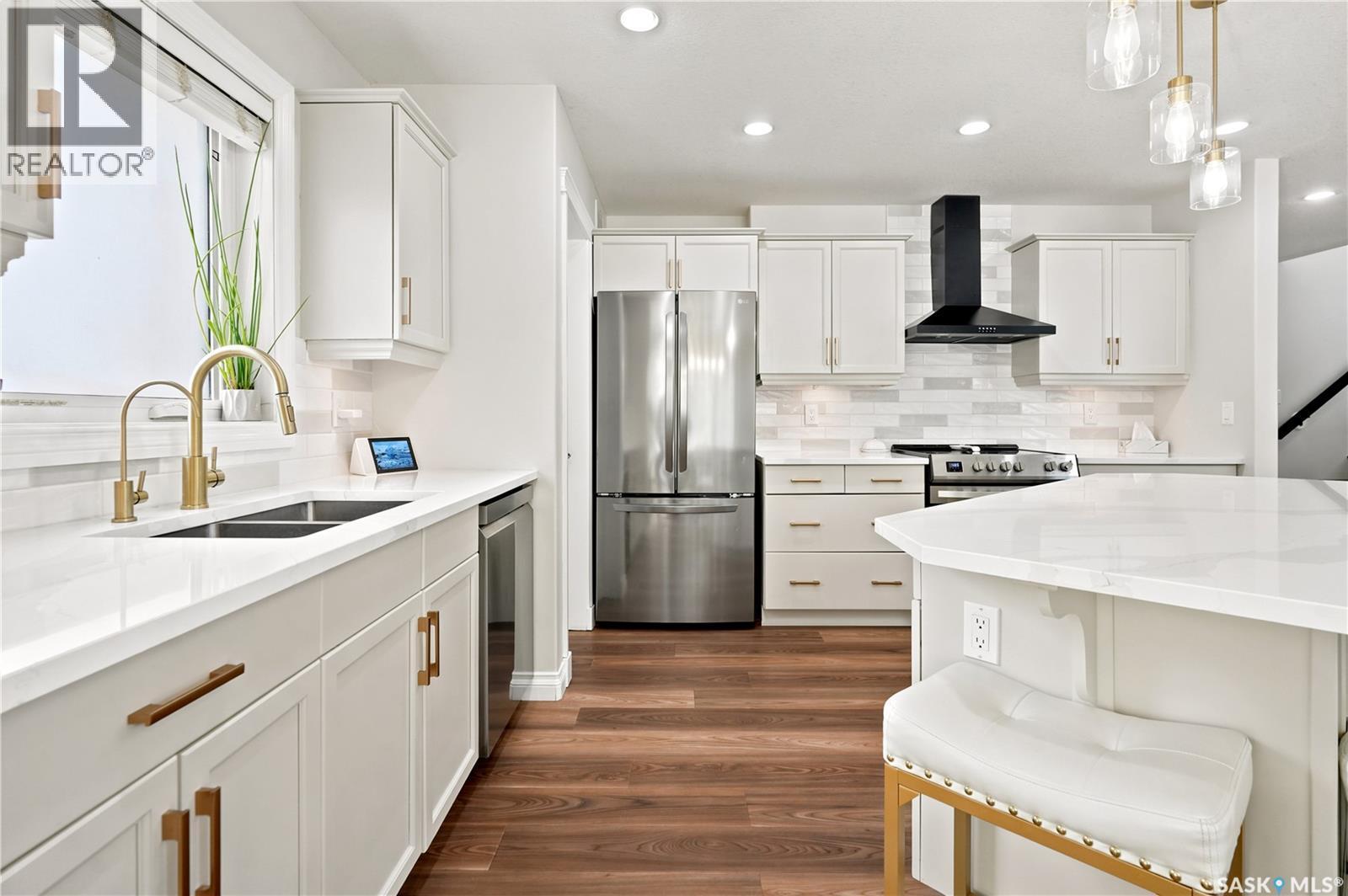 8607 Wascana Gardens Lane, Regina, SK - Indoor Photo Showing Kitchen With Stainless Steel Kitchen With Double Sink With Upgraded Kitchen
