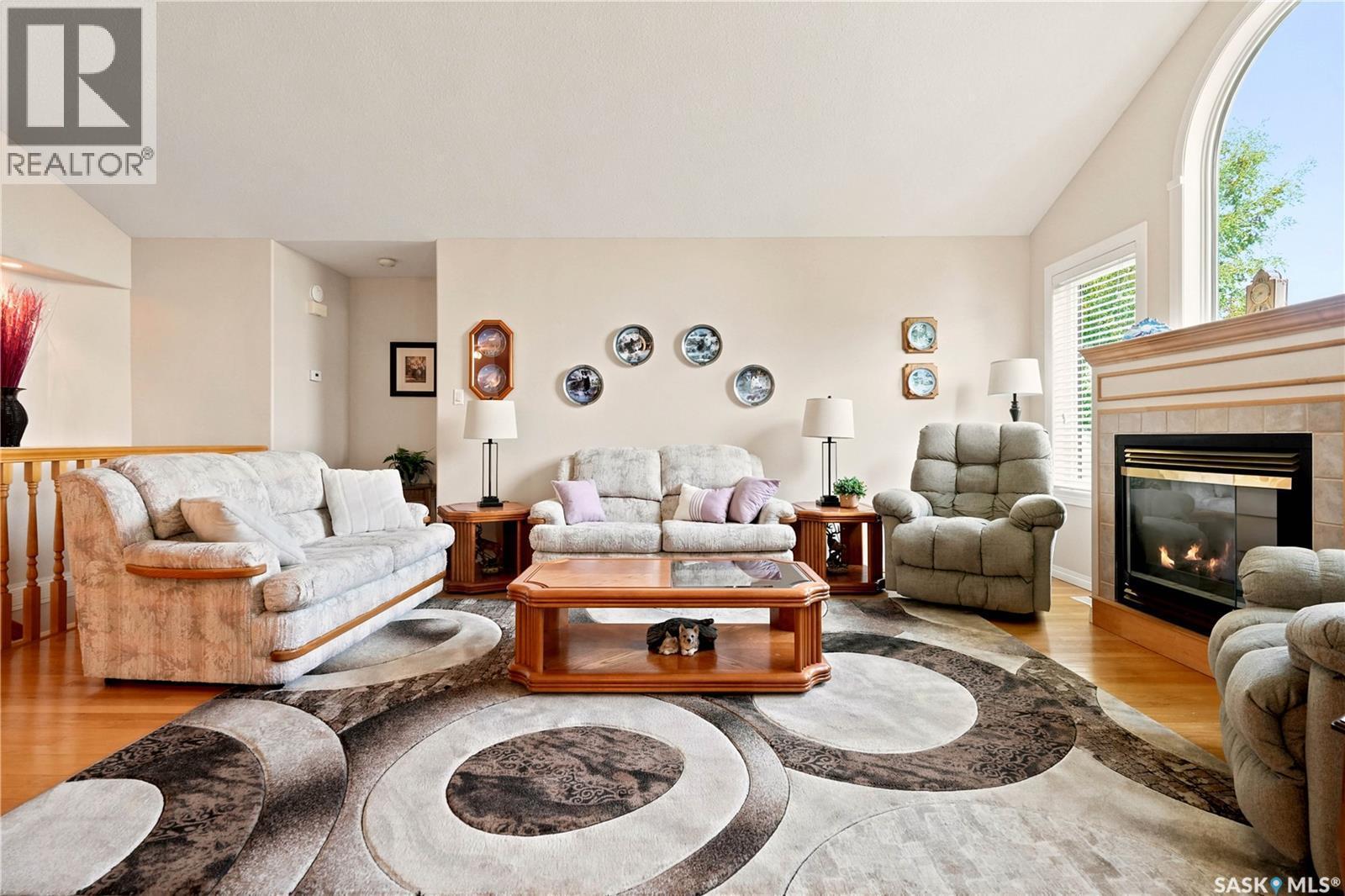 3291 Thames Crescent E, Regina, SK - Indoor Photo Showing Living Room With Fireplace