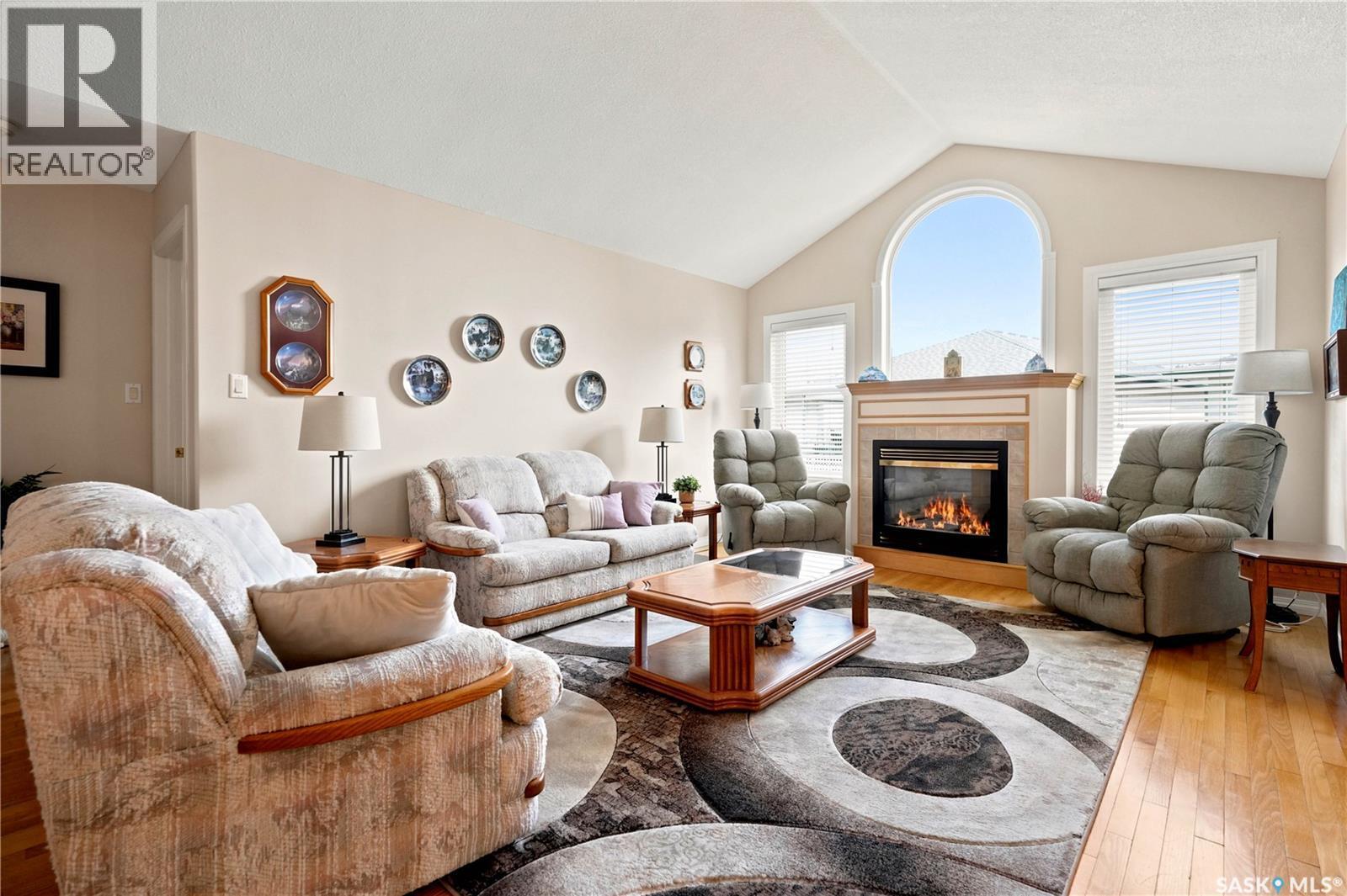 3291 Thames Crescent E, Regina, SK - Indoor Photo Showing Living Room With Fireplace