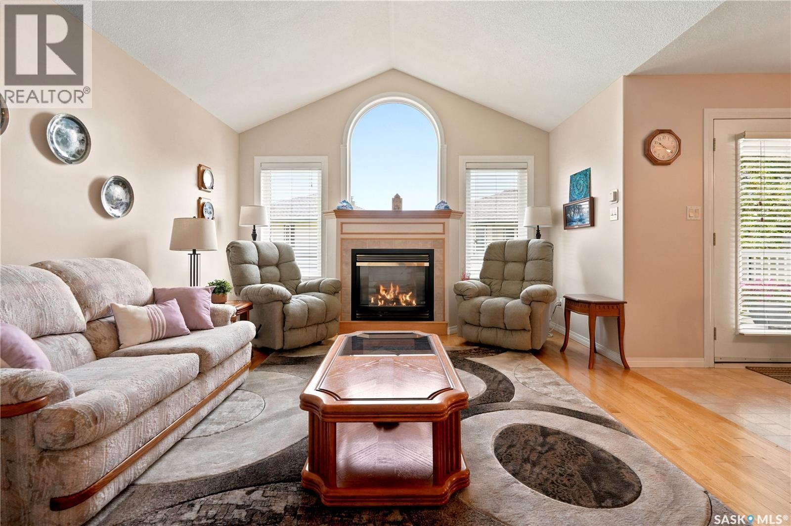 3291 Thames Crescent E, Regina, SK - Indoor Photo Showing Living Room With Fireplace