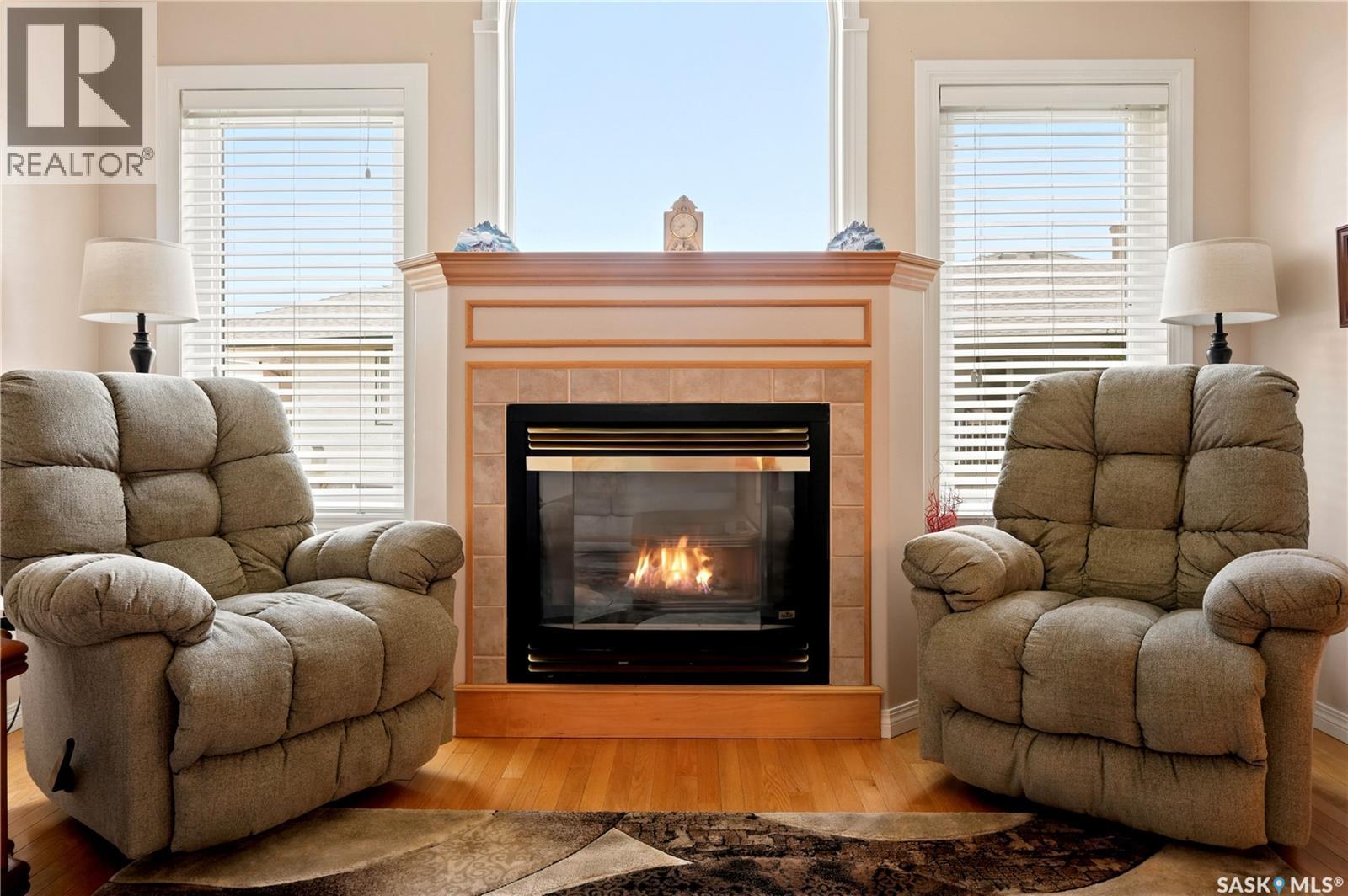 3291 Thames Crescent E, Regina, SK - Indoor Photo Showing Living Room With Fireplace