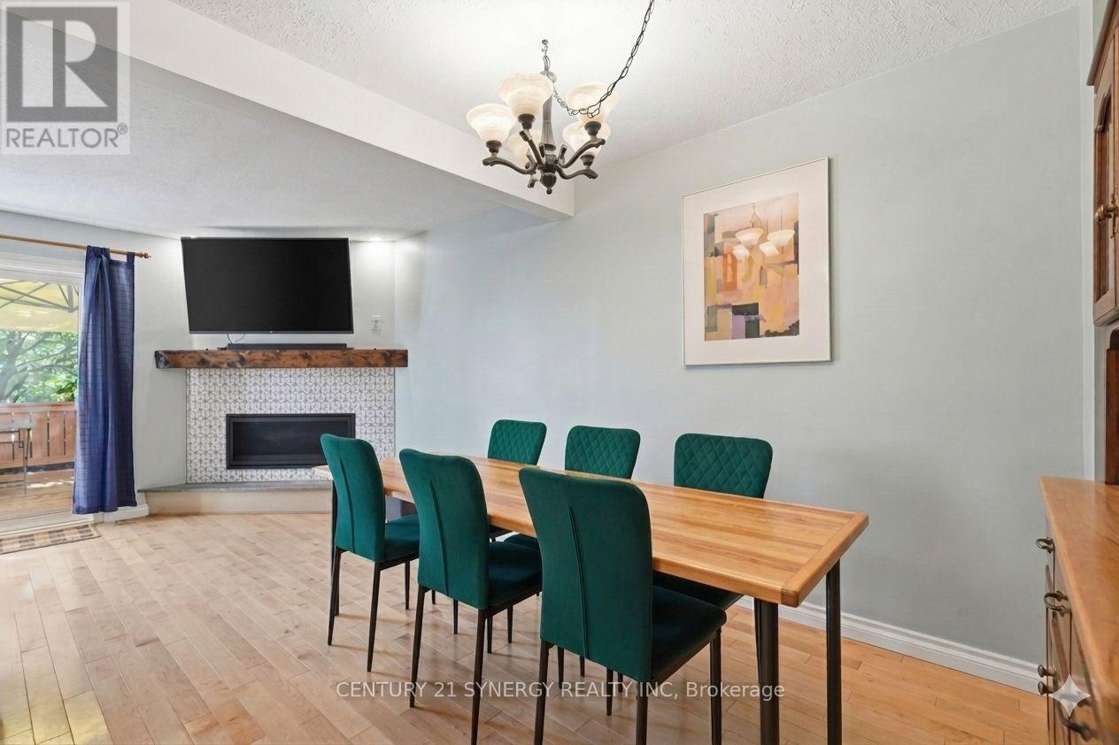 dining room - 417 Sandhamn Private, Ottawa, ON - Indoor Photo Showing Dining Room With Fireplace