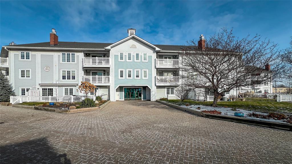 M-212-1520 Venetian Boulevard, Point Edward, ON - Outdoor With Balcony With Facade
