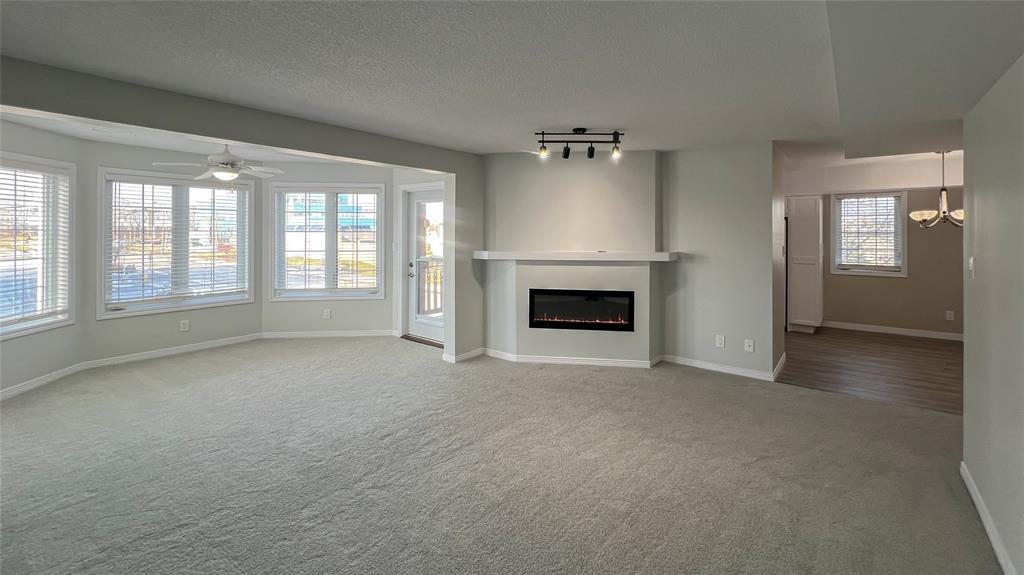 M-212-1520 Venetian Boulevard, Point Edward, ON - Indoor Photo Showing Living Room With Fireplace