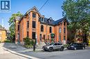 Brick exterior featuring decorative corbels and gables - 189 Hughson Street, Hamilton, ON 