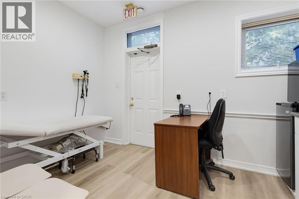Room #5 -Professionally Equipped/Furnished Office space featuring Door leading to the Wheelchair Accessible Lift. Has a sink and counter-top, and built-in cabinetry and a windows. - 189 Hughson Street, Hamilton, ON