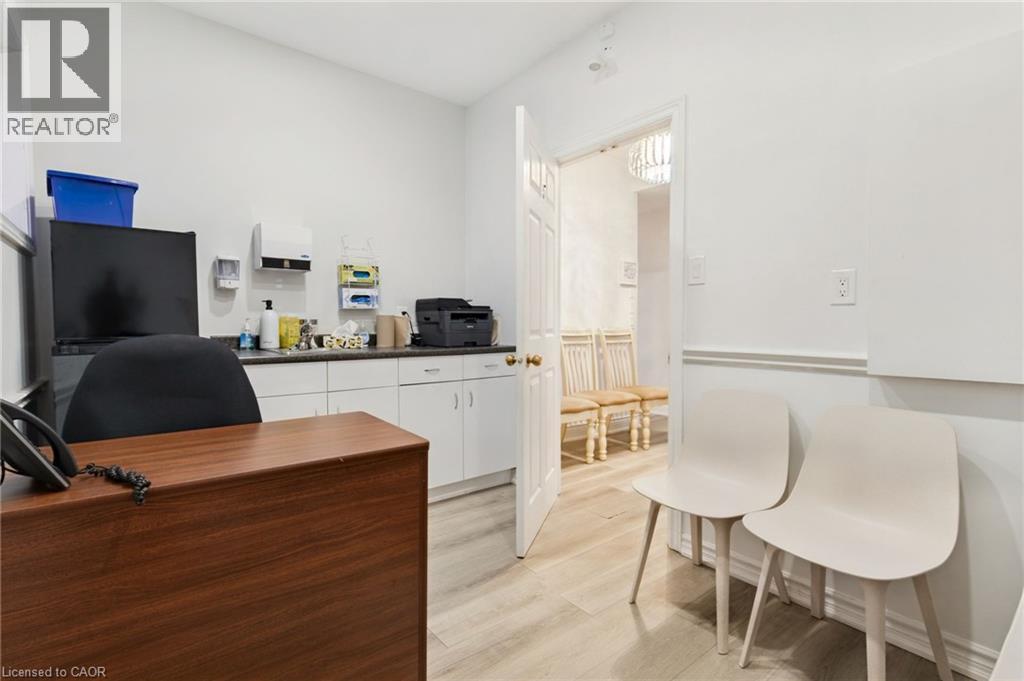 Room #5 -Professionally Equipped/Furnished Office space featuring Door leading to the Wheelchair Accessible Lift. Has a sink and counter-top, and built-in cabinetry and a windows. - 189 Hughson Street, Hamilton, ON