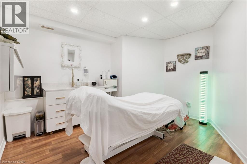 Room with wood-finish flooring and recessed ceiling lighting - 189 Hughson Street, Hamilton, ON