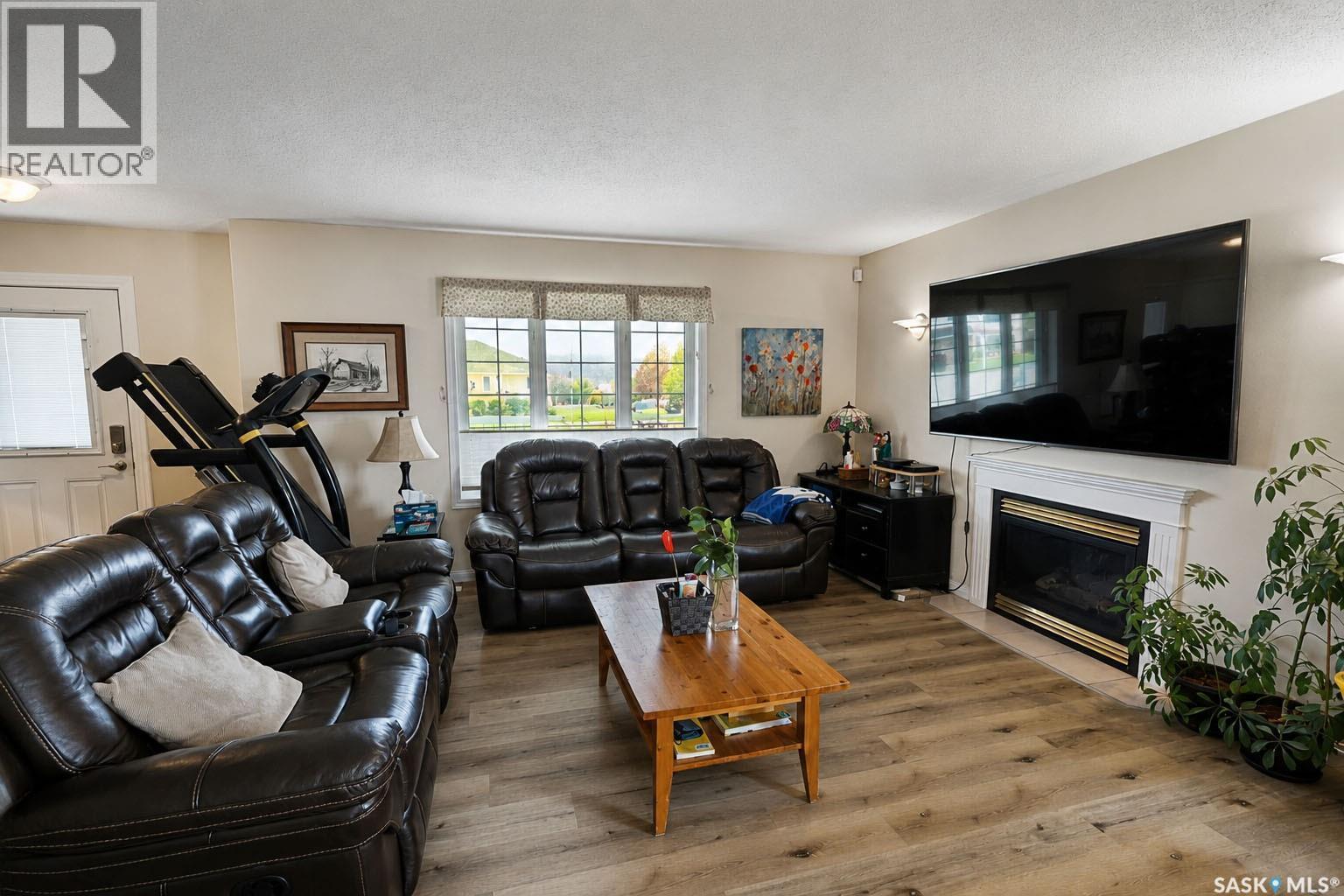 3 Meagher Place, Prince Albert, SK - Indoor Photo Showing Living Room With Fireplace