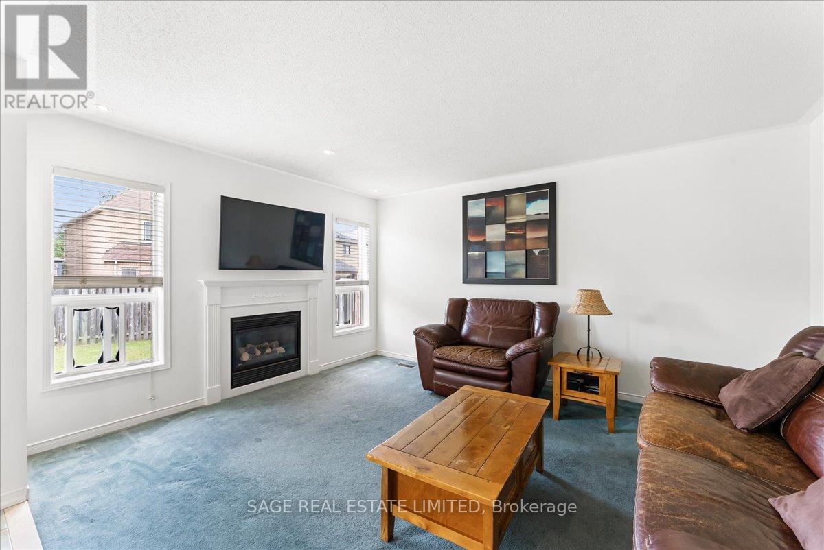 34 Mcsweeney Crescent, Ajax, ON - Indoor Photo Showing Living Room With Fireplace