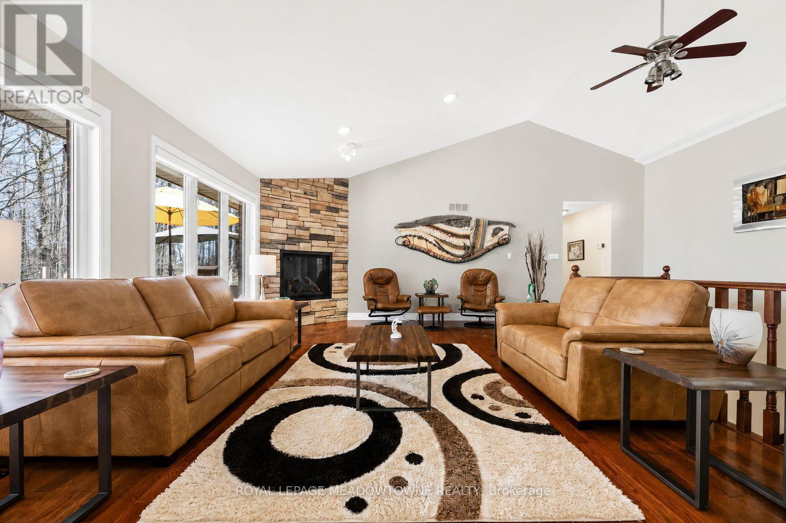 AI generated photo - 834603 4Th Line Ehs, Mono, ON - Indoor Photo Showing Living Room With Fireplace