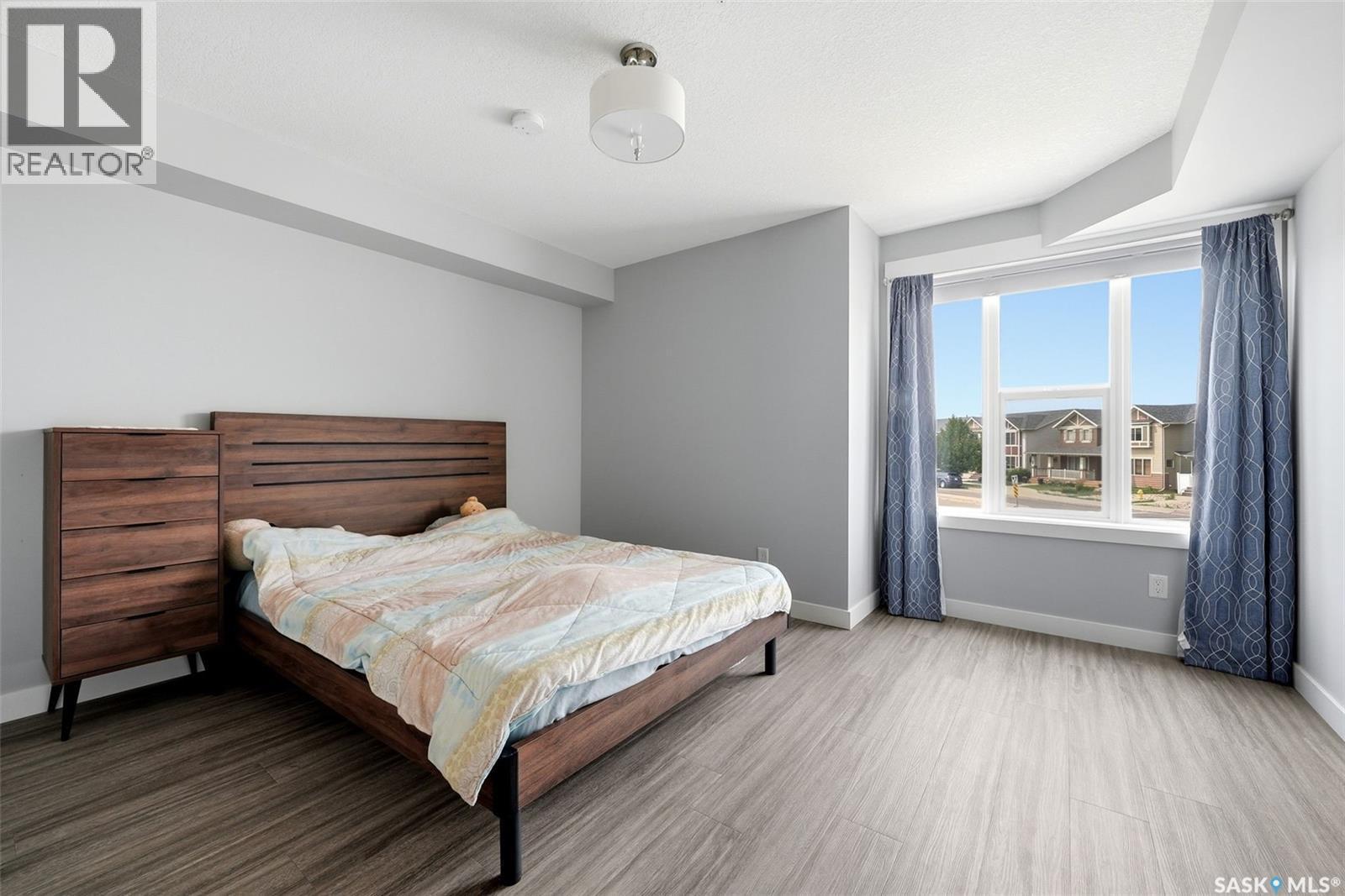 212 5301 Universal Crescent, Regina, SK - Indoor Photo Showing Bedroom