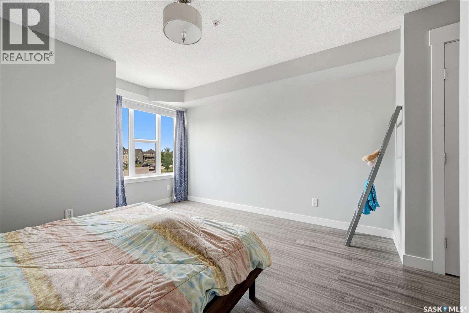 212 5301 Universal Crescent, Regina, SK - Indoor Photo Showing Bedroom