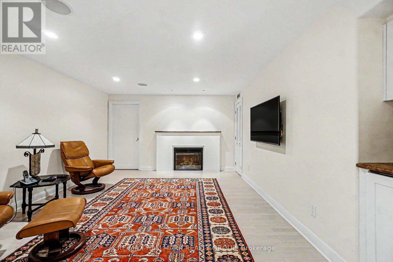 Rec room w/heated flr & fireplace - 2009 Killarney Drive, Ottawa, ON - Indoor With Fireplace
