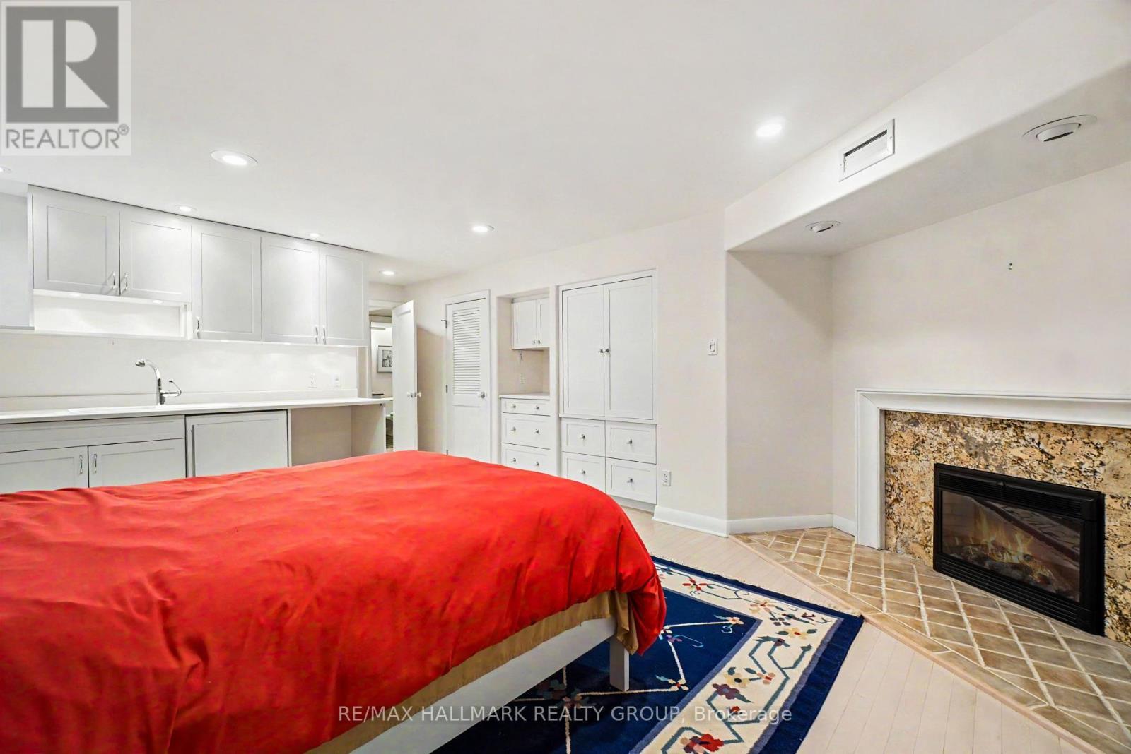 3rd bedroom w/heated flrs & fireplace - 2009 Killarney Drive, Ottawa, ON - Indoor Photo Showing Bedroom With Fireplace