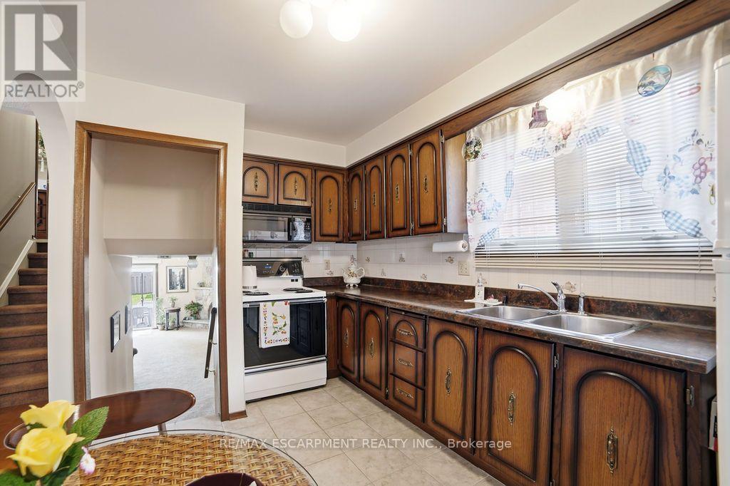 229 East 8Th Street, Hamilton, ON - Indoor Photo Showing Kitchen With Double Sink