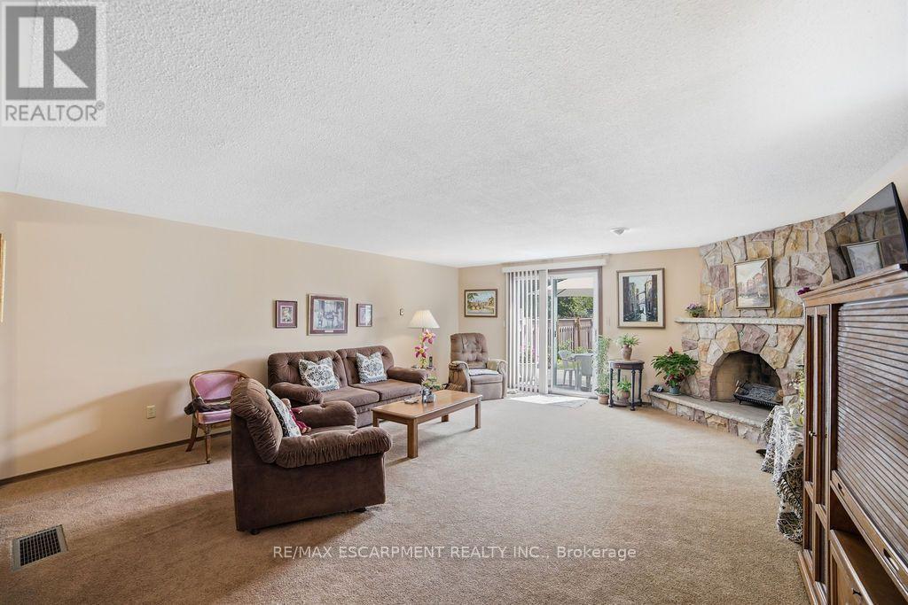 229 East 8Th Street, Hamilton, ON - Indoor Photo Showing Living Room With Fireplace