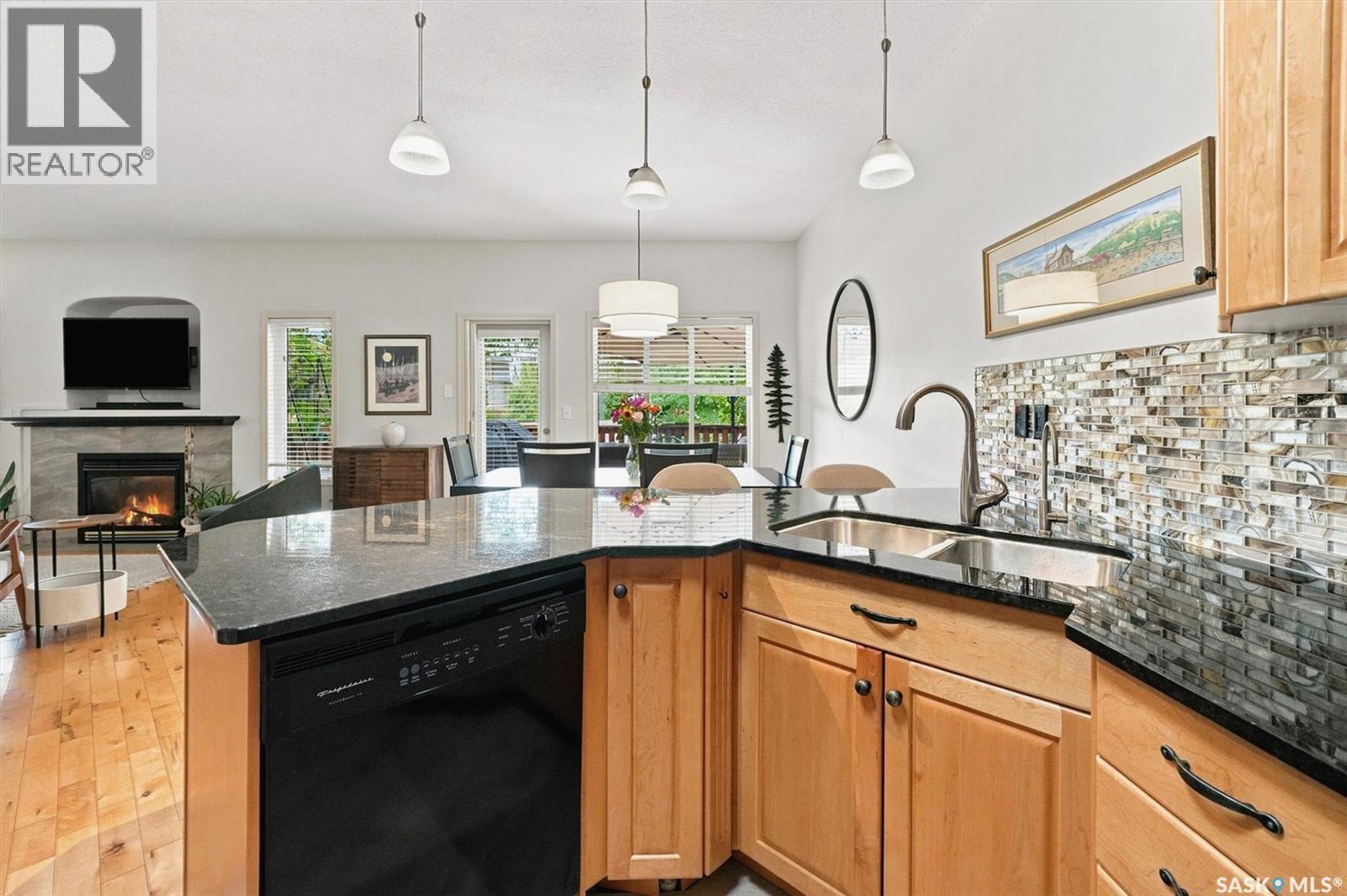 111 655 Kenderdine Road, Saskatoon, SK - Indoor Photo Showing Kitchen With Fireplace