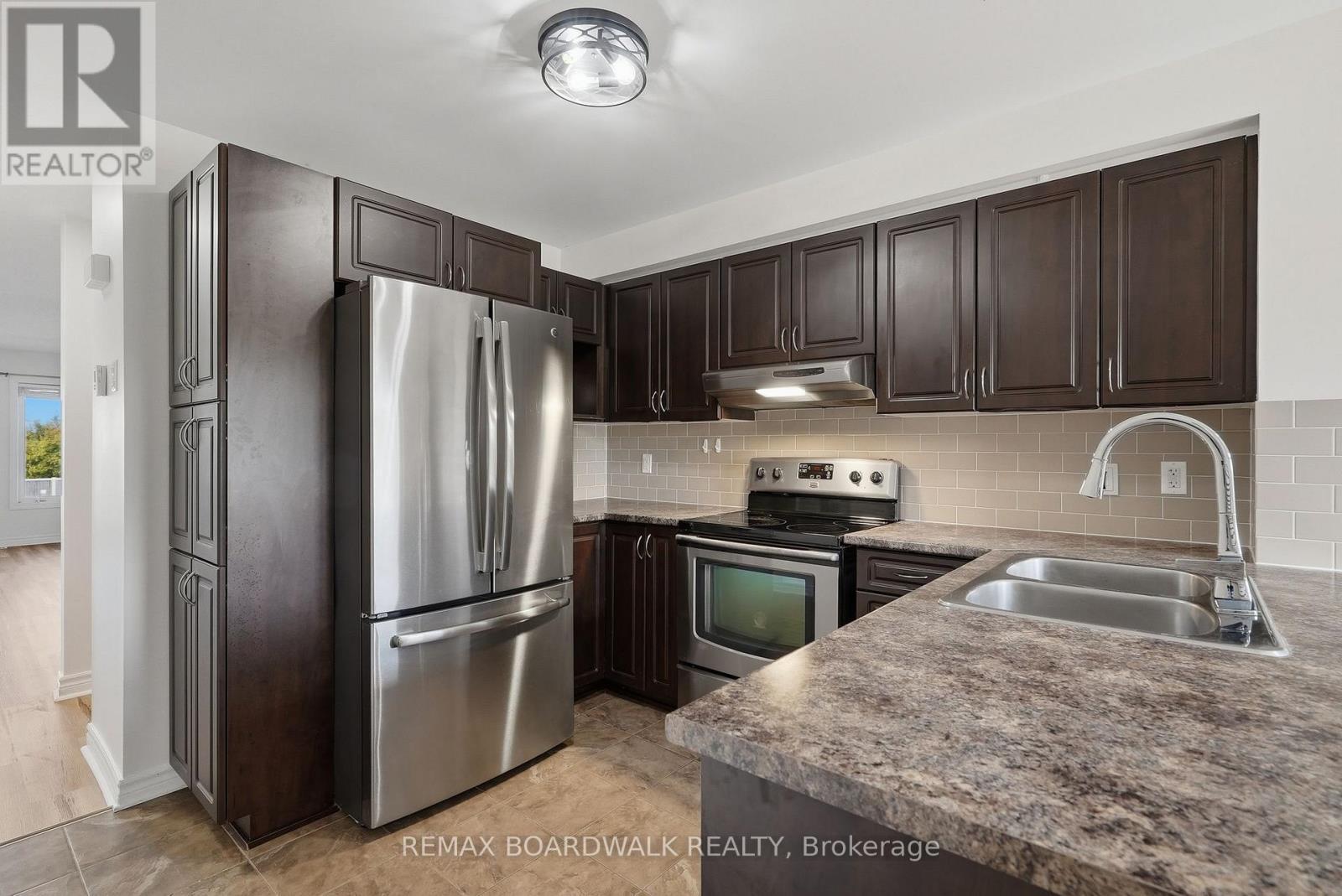 and stainless-steel appliances - 2330 Esprit Drive, Ottawa, ON - Indoor Photo Showing Kitchen With Stainless Steel Kitchen With Double Sink With Upgraded Kitchen