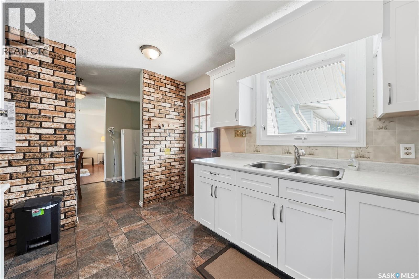 29 Macdowall Crescent, Prince Albert, SK - Indoor Photo Showing Kitchen With Double Sink