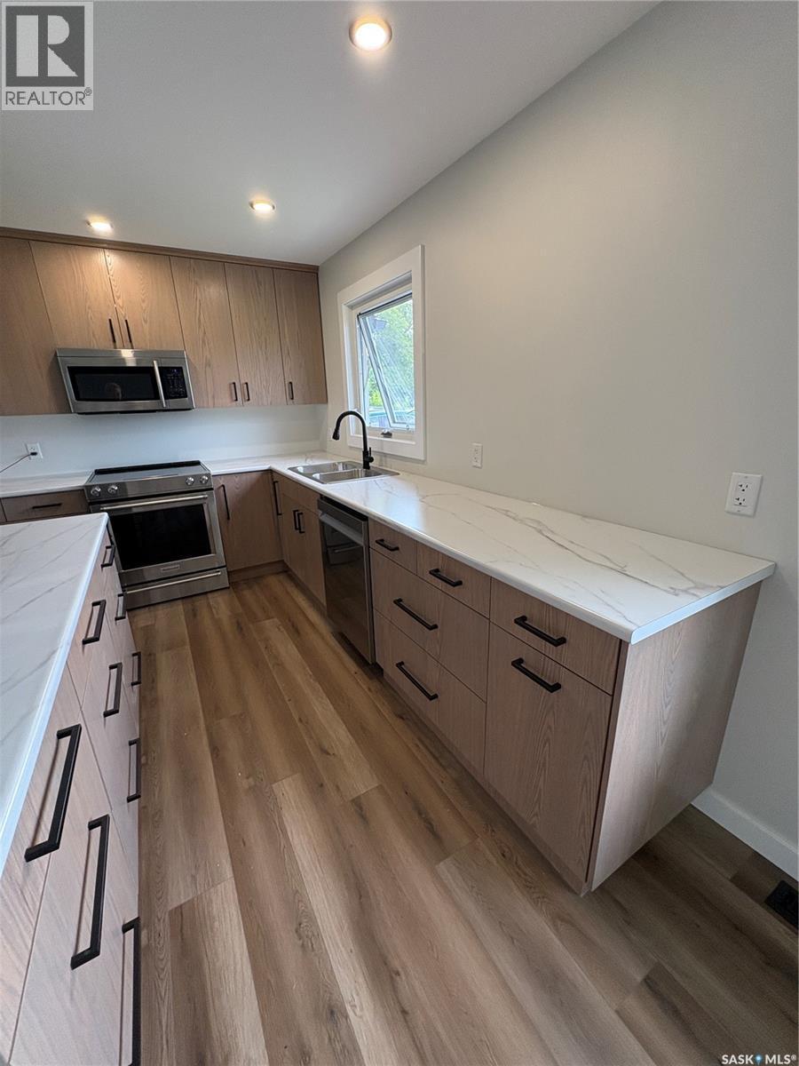 204 Birch Street, Kelvington, SK - Indoor Photo Showing Kitchen With Double Sink