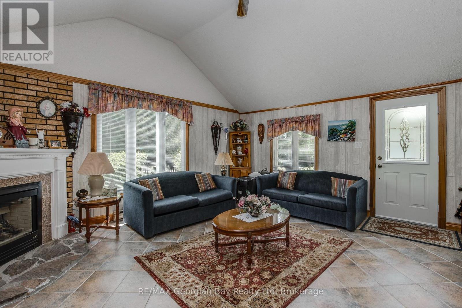 3 Brookside Drive, Tiny, ON - Indoor Photo Showing Living Room With Fireplace