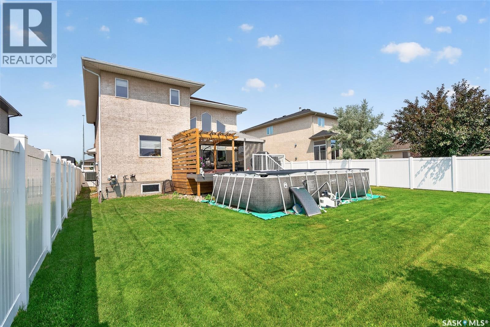 69 Goldenglow Drive, Moose Jaw, SK - Outdoor With Above Ground Pool With Backyard