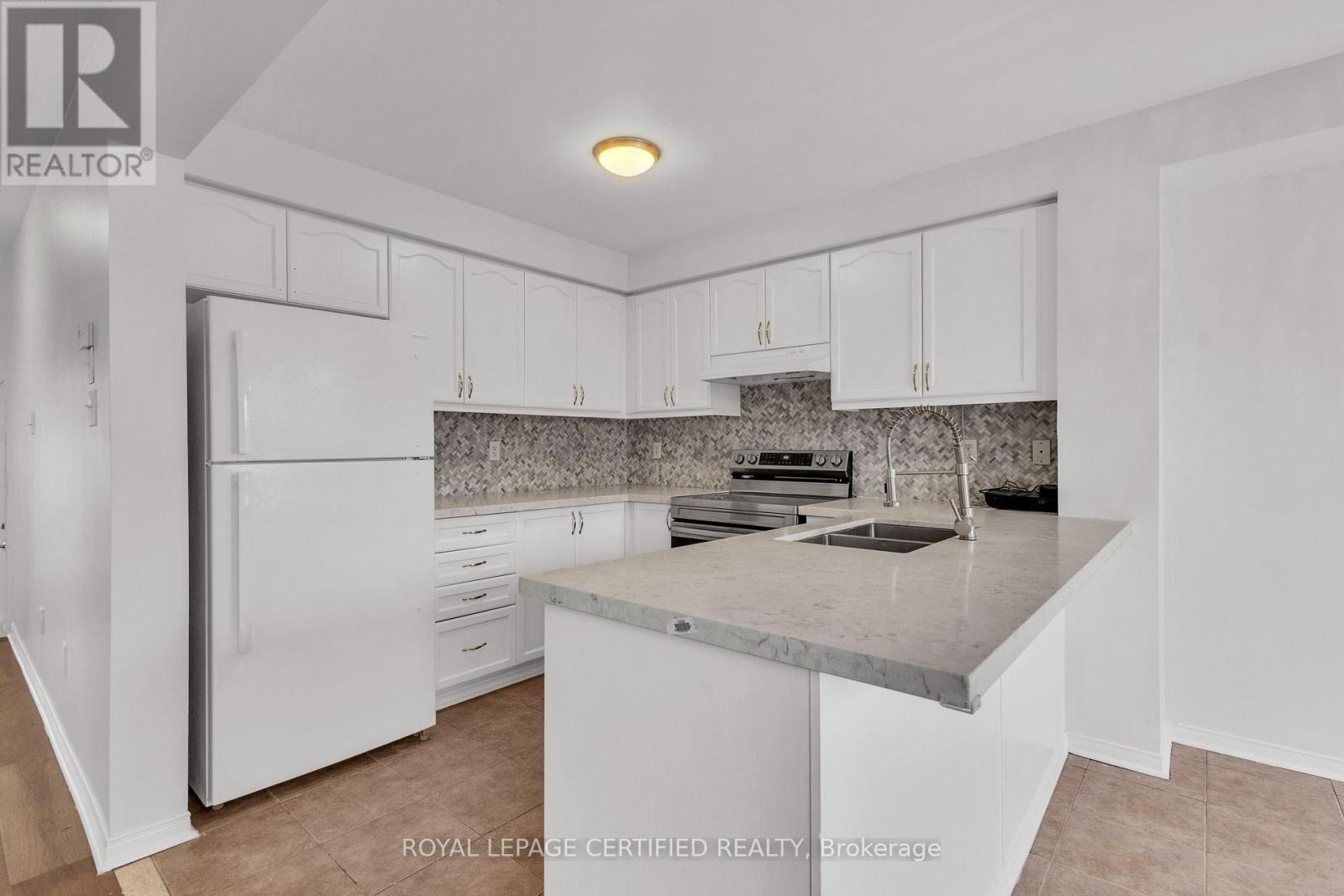 114 Botavia Downs Drive, Brampton, ON - Indoor Photo Showing Kitchen With Double Sink