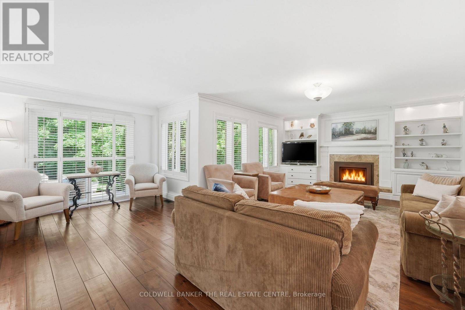 Family room Large Windows - 49 Falling Leaf Court, Aurora, ON - Indoor Photo Showing Living Room With Fireplace