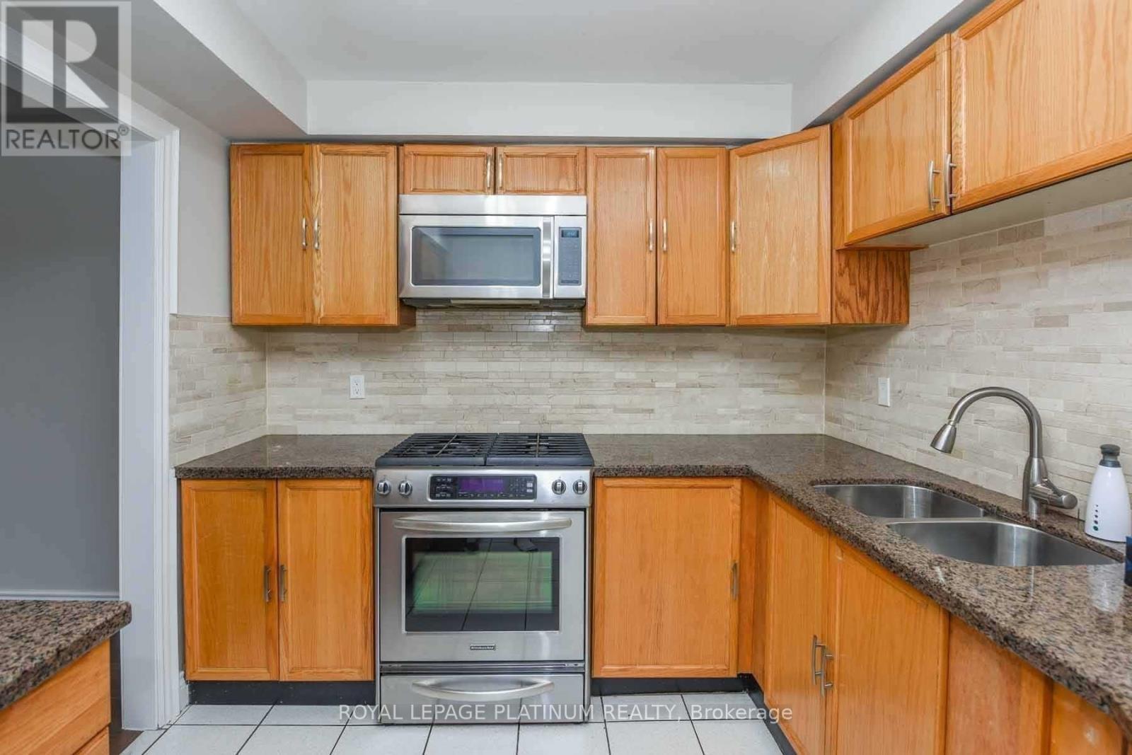 63 Lord Simcoe Drive, Brampton, ON - Indoor Photo Showing Kitchen With Double Sink