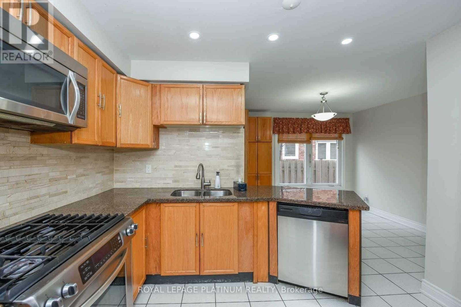 63 Lord Simcoe Drive, Brampton, ON - Indoor Photo Showing Kitchen With Double Sink