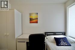 White walls with a window featuring privacy blinds -