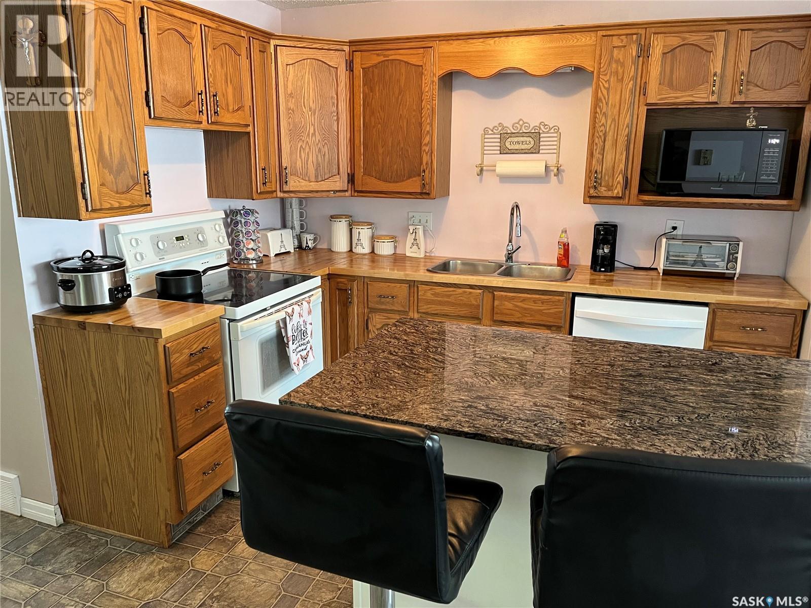 214 Westview Drive, Coronach, SK - Indoor Photo Showing Kitchen With Double Sink