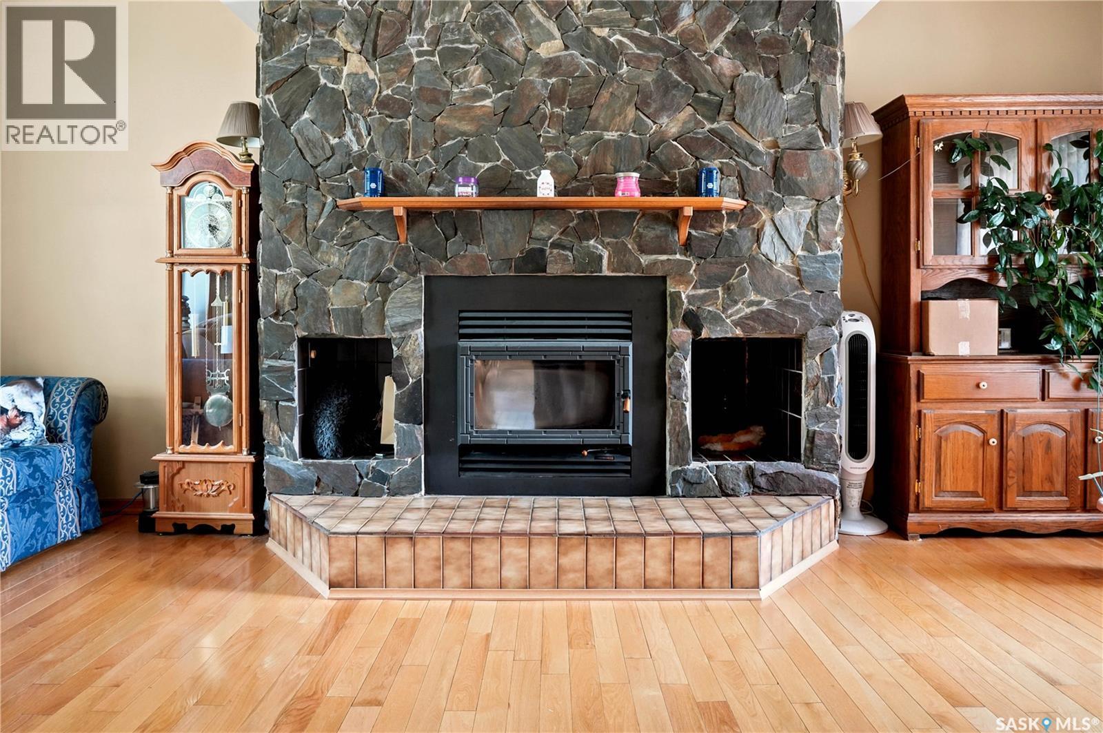 749 Gibson Road, Balgonie, SK - Indoor Photo Showing Living Room With Fireplace