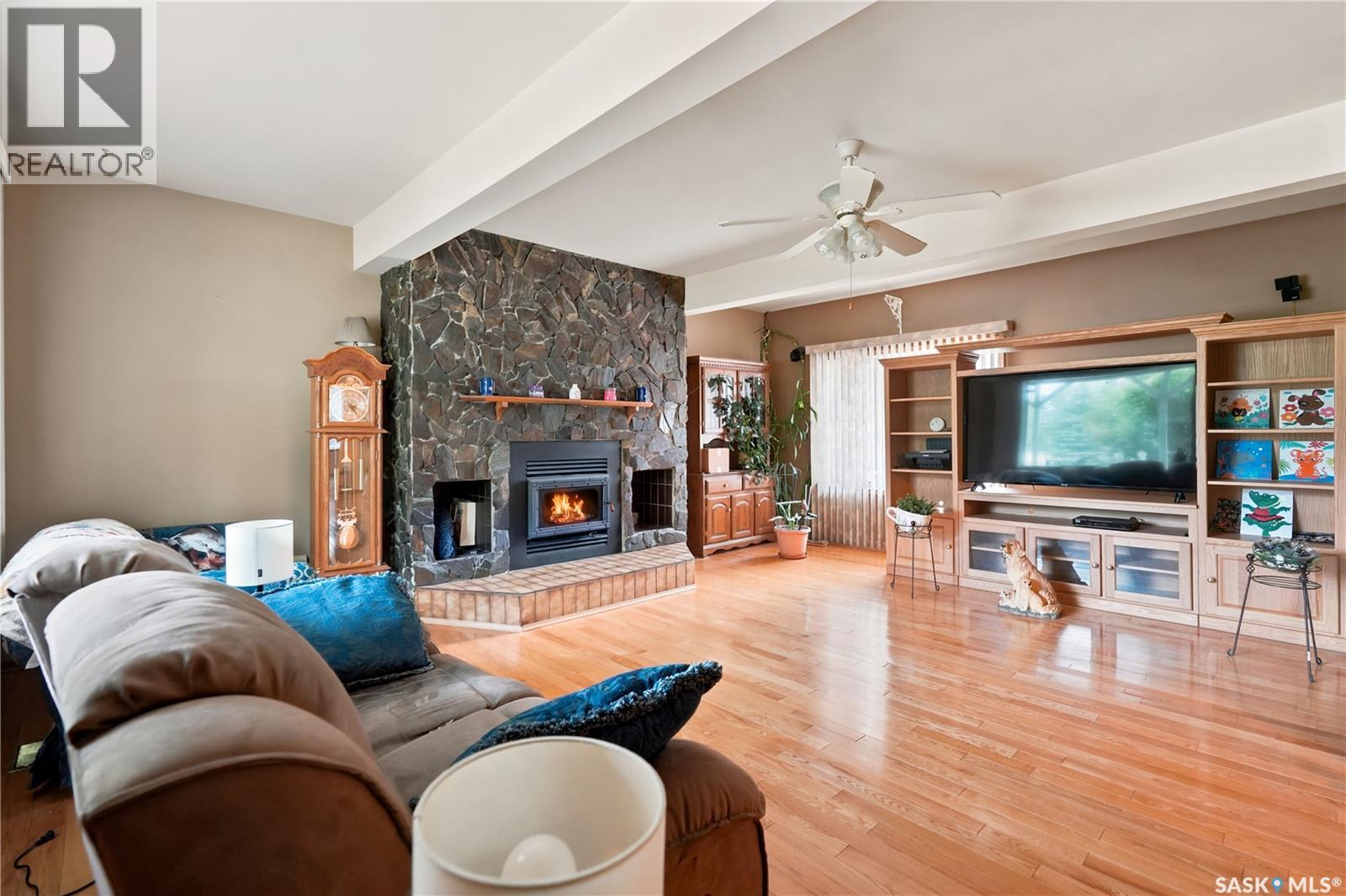 749 Gibson Road, Balgonie, SK - Indoor Photo Showing Living Room With Fireplace