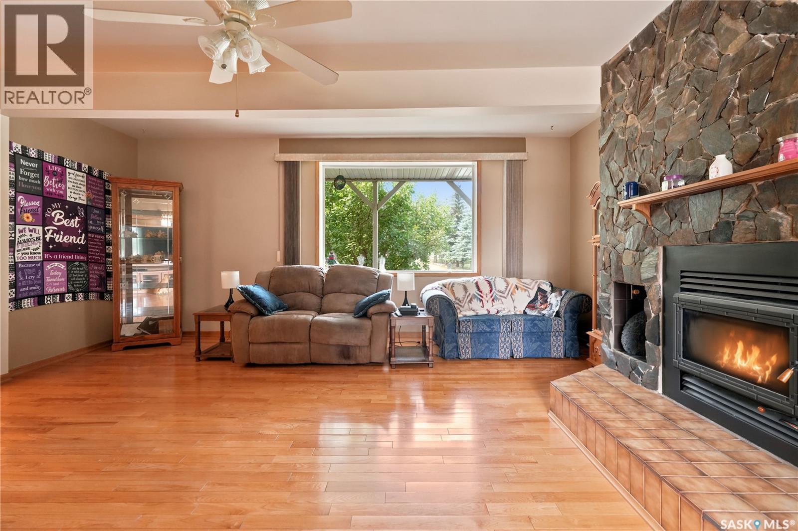749 Gibson Road, Balgonie, SK - Indoor Photo Showing Living Room With Fireplace