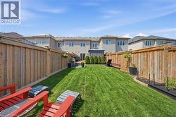 Expansive lawn area enclosed by wood fencing - 