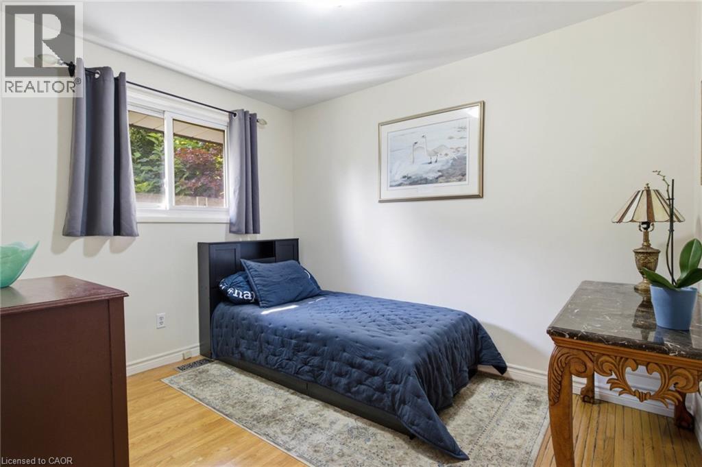 Bedroom with light wood-finish flooring and a white ceiling - 11 Summit Crescent, Guelph, ON - Indoor Photo Showing Bedroom